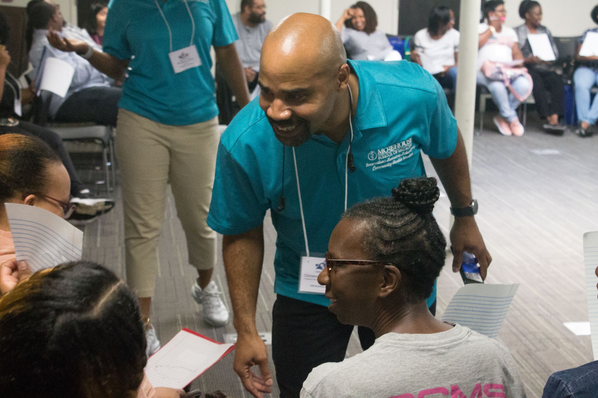 A man works with high schoolers as part of the program