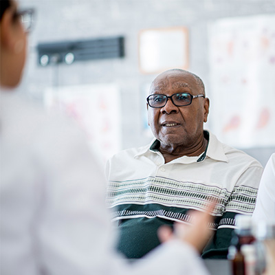 a man listens to a doctor