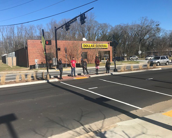 community health course students standing in the middle of a street