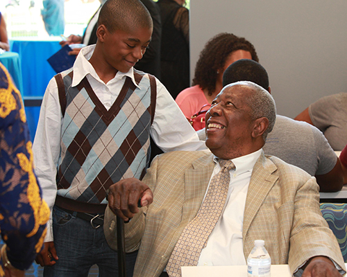 Hank Aaron at Gloster Event talking to boy